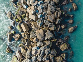 Close-up shot of large rocks surrounded by  turquoise waters of  Murrells Inlet, South Carolina
