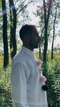 person in the park, man with flowers, flowers, boquet of flowers, man with floral arrangement, portrait of a man in nature, woman, nature, beauty, summer, garden, flower, person, dress, people, fashio
