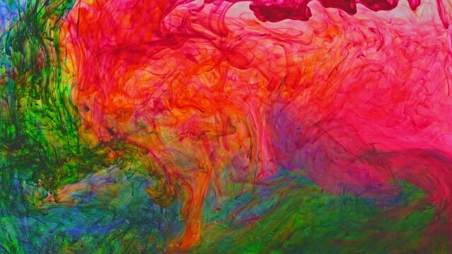 Colored powder flakes dissolved in water and spreads slowly when mixed with other colors to form new colors..Colorful footage brings a dreamy and surreal atmosphere..color dissolves in the water. 