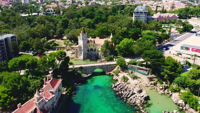 Cascais coastal resort town in Lisbon at sunny summer day, drone point of view of townscape. Turquoise waters of the Atlantic Ocean, rocky coastline. Travel, tourism concept. Portugal