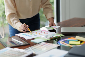 Fototapeta premium Startup Architect creative designer working with new project ideas color palette at office..