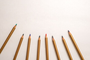 Colored pencils disordered on white background. Group of pencils of different colors.
