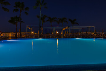 Beautiful night view of hotel with outdoor pool on night sky background. Spain. Gran Canaria.