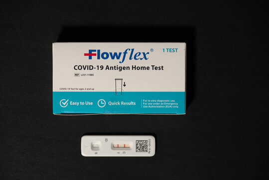 Davis, CA. 29 July 2023. Flowflex covid-19 rapid antigen test positive result against black background