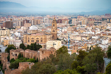 Fototapeta na wymiar Panoramic aerial view of Malaga in a cloudy summer day in the morning in Malaga, Spain on July 17, 2023