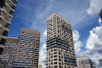 Fototapeta na wymiar Modern residential high-rise buildings against the blue sky.