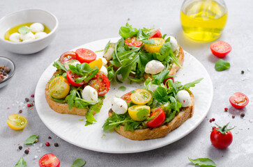 Bruschetta with Cherry Tomatoes, Mini Mozzarella Cheese and Pesto Sauce, Caprese Toasts