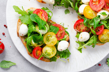 Bruschetta with Cherry Tomatoes, Mini Mozzarella Cheese and Pesto Sauce, Caprese Toasts