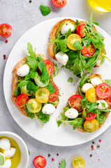 Bruschetta with Cherry Tomatoes, Mini Mozzarella Cheese and Pesto Sauce, Caprese Toasts