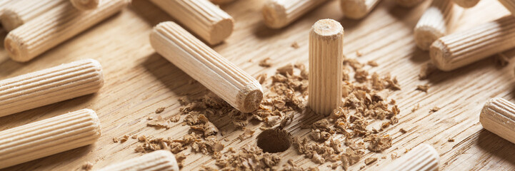 hole in wooden oak board for wooden dowel. carpentry industry.
