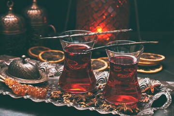 Cups of turkish tea served in traditional style with spices - obrazy, fototapety, plakaty