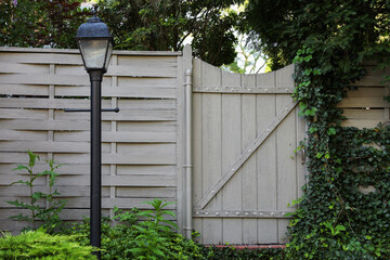 gates guard access, signifying boundaries, protection, and control. Barriers embrace both...