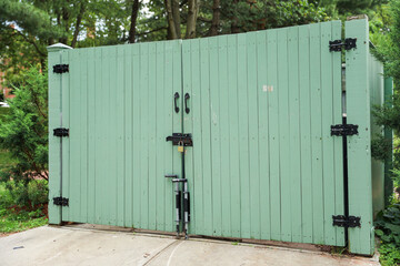 gates guard access, signifying boundaries, protection, and control. Barriers embrace both...