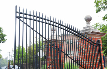 gates guard access, signifying boundaries, protection, and control. Barriers embrace both...