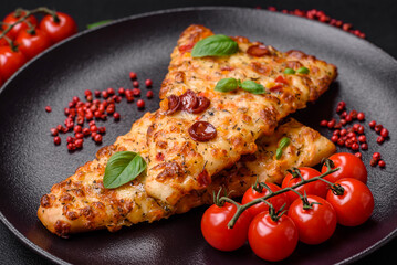 Delicious oven fresh flatbread pizza with cheese, tomatoes, sausage, salt and spices