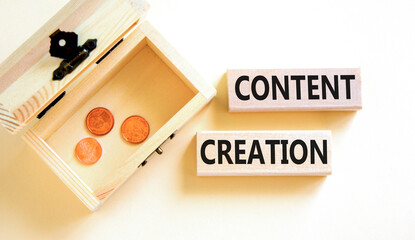 Time for content creation symbol. Concept words Content creation on wooden blocks. Beautiful white table white background. Wooden chest with coins. Business content creation concept. Copy space.