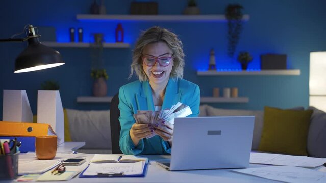 Home office worker woman counting money funny and funny.