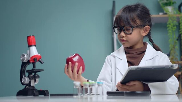 A Little girl dressed as a scientist, studying knowledge in science experiments.