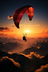 paraglider silhouette at sunset