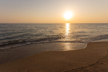 Fototapeta na wymiar a sunset on the sea beach