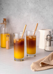 Food photography of Coffee; bumblebee; orange; juice; iced; drink; beverage; refreshment; sugar; straw; cool; freshness;