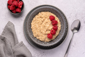 Food photography of oatmeal, porridge, raspberry, fibre, ripe, vegan, wholegrain, lifestyle, dish, berry, homemade
