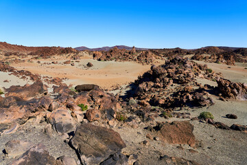 Landscape in the mountains with a volcano. A lifeless desert with lots of rocks and lava remnants