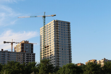 Fototapeta premium construction site with cranes. building under construction