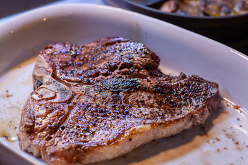 T bone steak dinner with sides.
