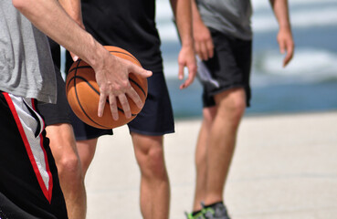 Fototapeta premium Group of people playing street basketball