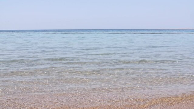 Sea water wave come to beach. Landscapes view of beach sea sand and sky in summer day. Beach sea space area on the tropical island. Advertising, background picture. Summer background. High quality 4k