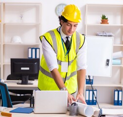 Male construction engineer working in the office