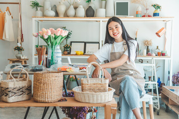 Small business owners pose smiling in their small shop to welcome customers and get customers online. And check the orders that customers have ordered of online retailers - online shopping.