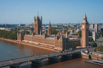 Big Ben, Westminster Bridge on River Thames in London, the UK. English symbol. Lovely puffy clouds,...