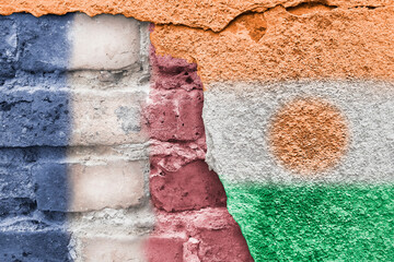 France and Niger. Nigerian and French flag. Flags of countries on background of brick wall. Street...