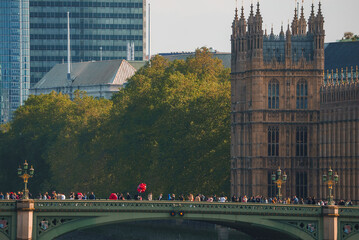 Big Ben, Westminster Bridge on River Thames in London, the UK. English symbol. Lovely puffy clouds,...