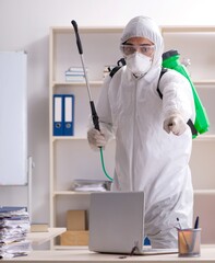 Professional contractor doing pest control at office