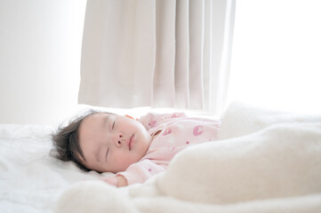 Fototapeta na wymiar 眠る赤ちゃん 