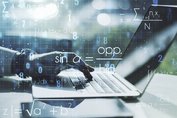Naklejka premium Double exposure of creative scientific formula concept with hands typing on laptop on background, research and development concept