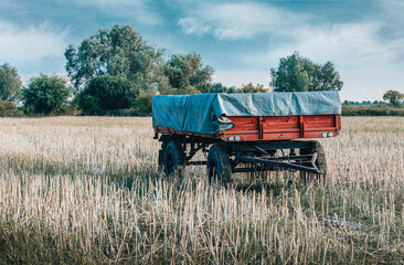 old trailer standing in a field 