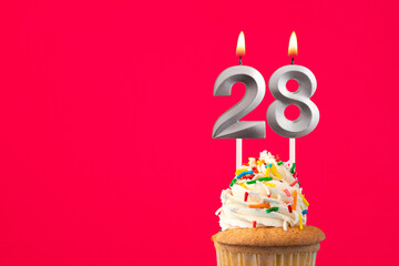 Horizontal birthday card with cake - Burning candle number 28