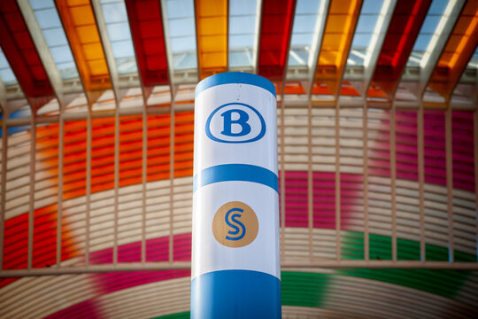 LIEGE, BELGIUM - NOVEMBER 9, 2022: Logo of SNCB NMBS Belgian Railways in front of Liege Guillemins train station. SNCB, or Societe Nationale des Chemins de Fer Belges is Main train carrier in belgium.