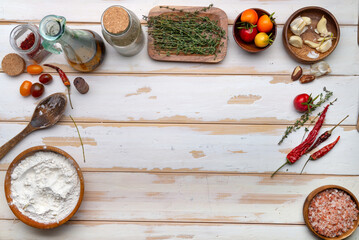 Top view of a table with ingredients for making focacci. Space for text.