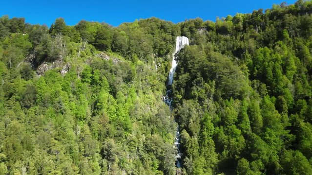 Dron view of waterfall near heart shape lagoon Laguna corazon in Chile. Waterfall near Lican Ray
