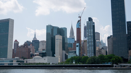 Fototapeta na wymiar View of midtown of Manhattan and United Nations headquarters building across the East River.