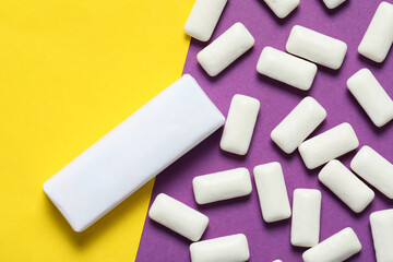 Pack with tasty chewing gums on color background, flat lay. Space for text