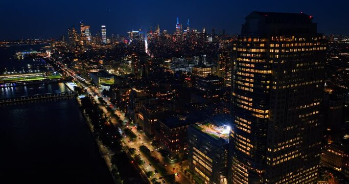 Never sleeping New York at night. Breathtaking cityscape with lively traffic and multiple lights on. Top view.