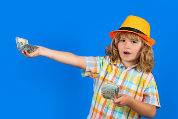 Cash money dollars bills. Studio portrait of child with money banknotes. Kid with money for future. Children learning financial responsibility about saving money.