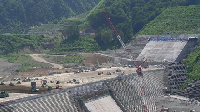 Akita, Japan - July 29, 2023: Concrete placement or concrete casting at construction of Naruse dam in Akita, Japan

