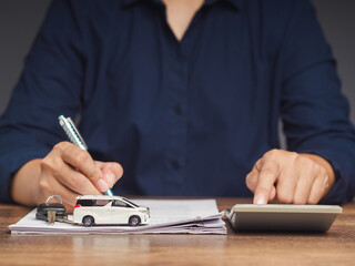 Car loan concept. Signing the car loan agreement